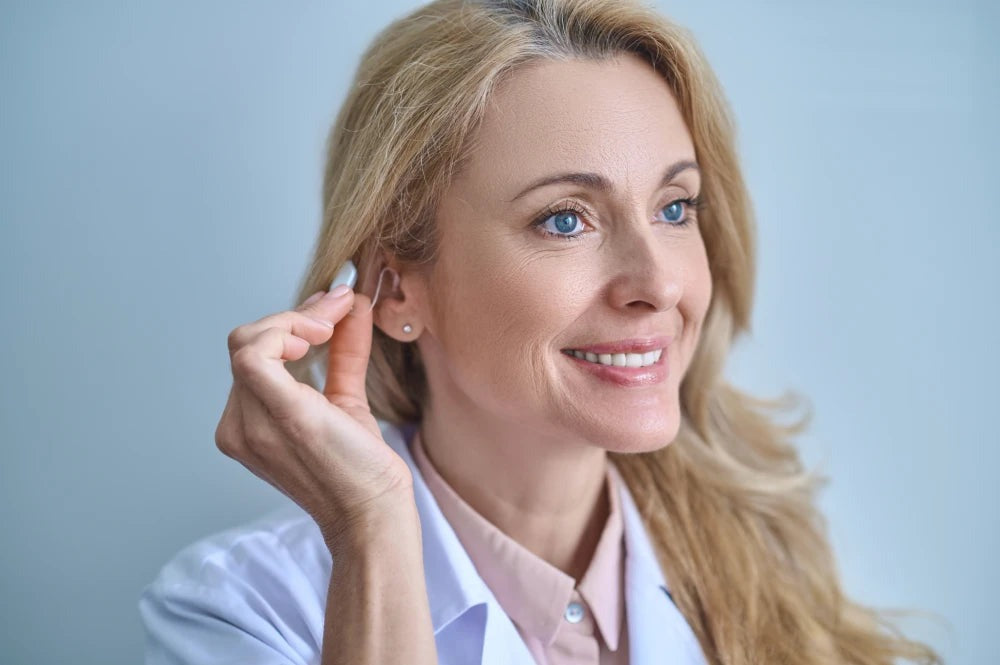 doctor-testing-hearing-aid-his-e.jpg__PID:e01627d5-7419-44e8-953f-cc573518128c